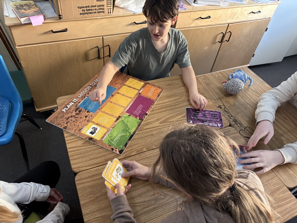 Students explore science concepts through interactive materials.