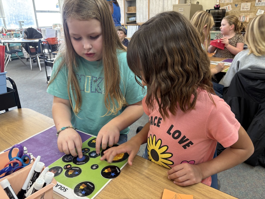 Students explore science concepts through interactive materials.