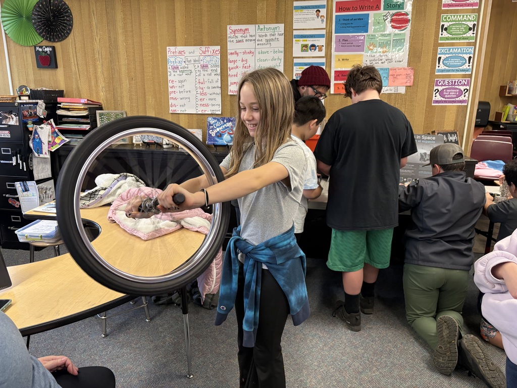 Students explore science concepts through interactive materials.