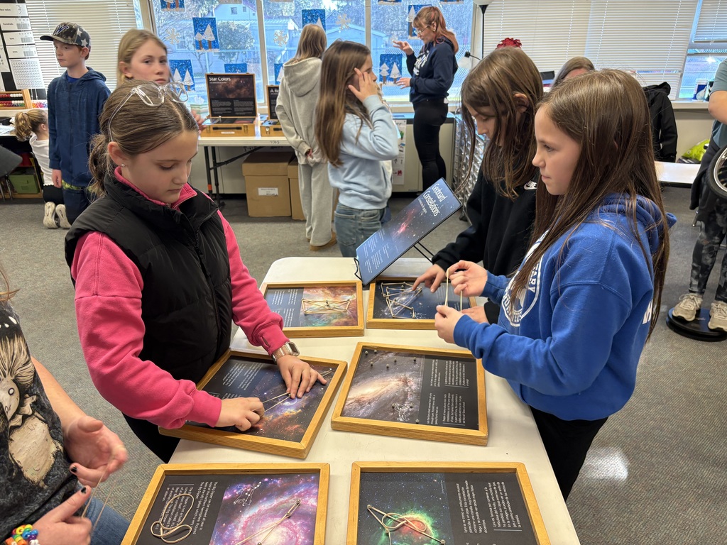 Students explore science concepts through interactive materials.