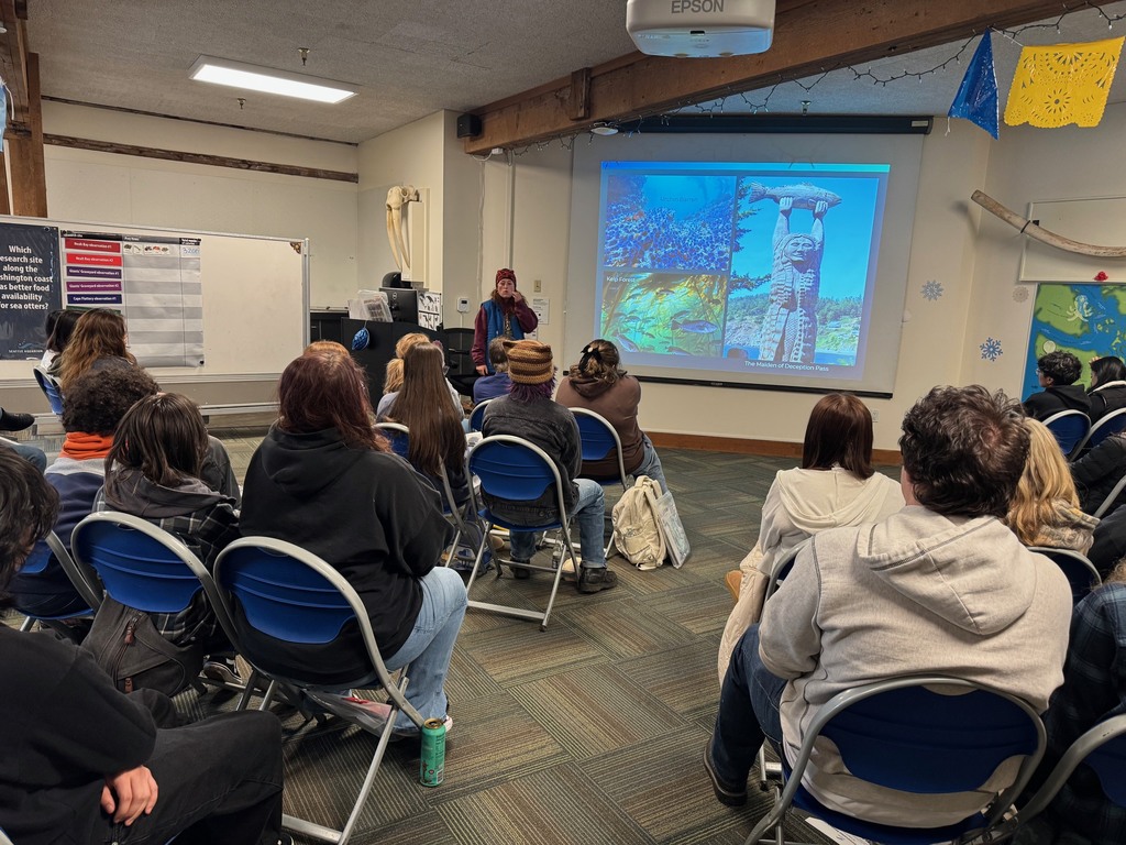 Students explore exhibits at the Seattle Aquarium while learning about ocean habitats and the role scientists play in protecting marine wildlife.