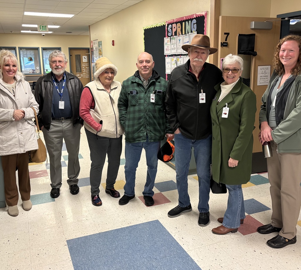 Washington State Senator Keith Wagoner and Washington State Representative Carolyn Eslick stand with community members, Sedro-Woolley School Board members, and school leaders during a visit to Samish Elementary School. The group is receiving a tour of the school from Samish Elementary Principal Laura Schmidt and Interim Superintendent Brian Isakson while discussing rural school facilities and student needs.