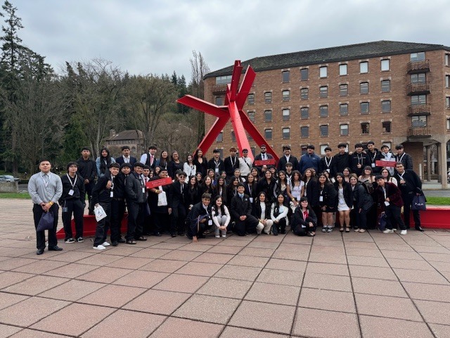 Students from Sedro-Woolley High School participating in a youth leadership conference, including group activities, presentations, and recognition of student achievements in writing and visual arts.