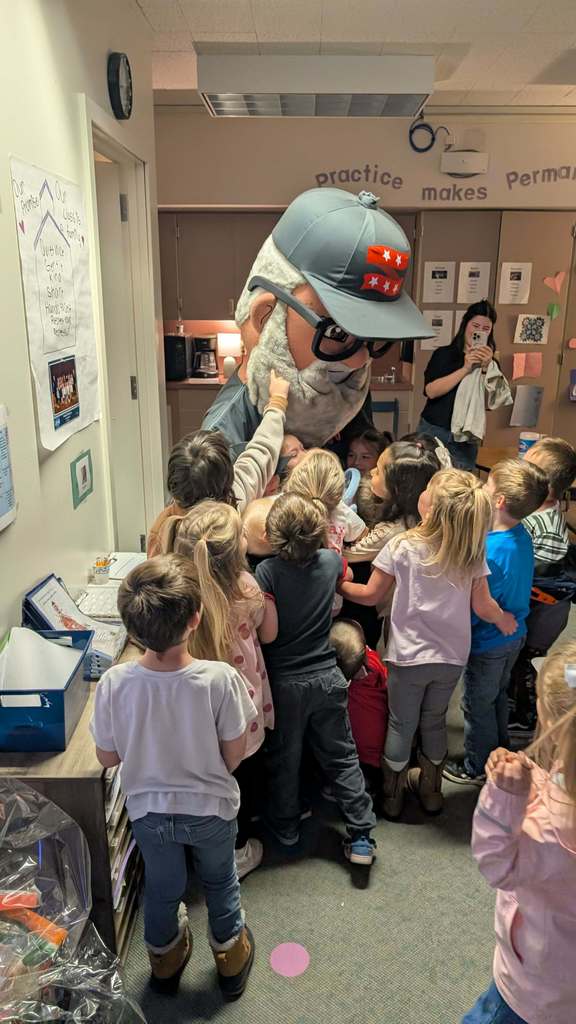 Students hug Mr. 360.