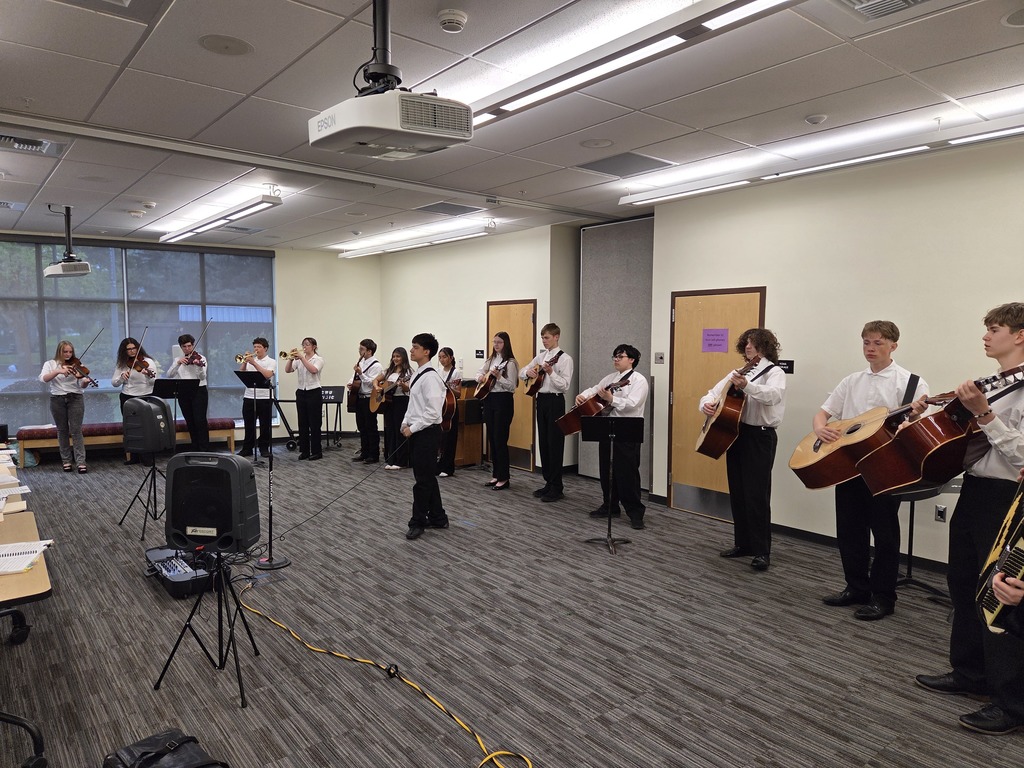 Sedro-Woolley High School mariachi students in performance attire at Central Washington University during the State Solo & Ensemble Music Competition, holding instruments.