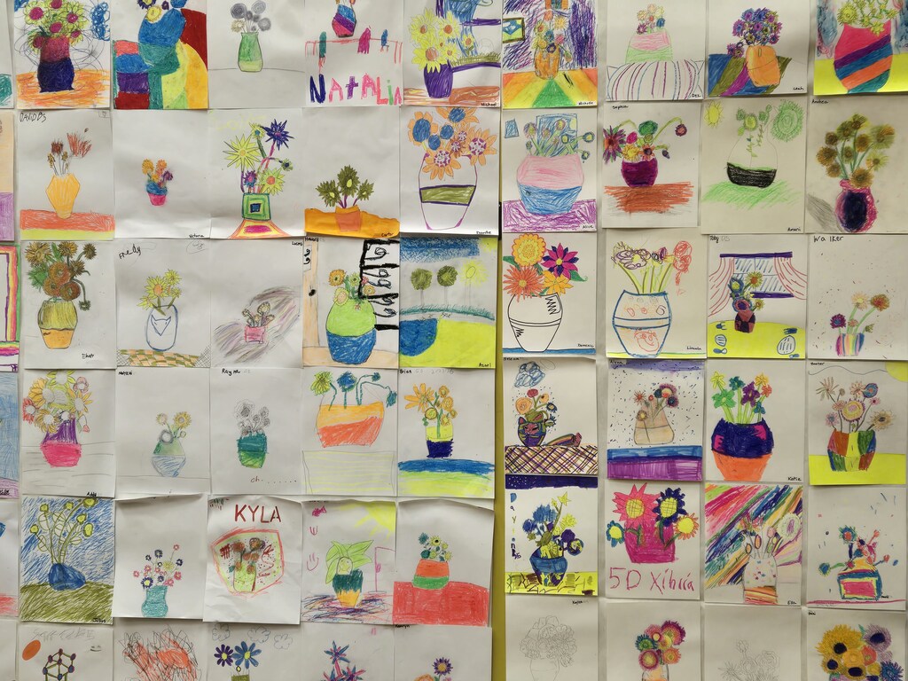 Students and families were able to explore glowing Vincent Van Gogh-inspired artwork during Evergreen STEM Elementary School’s art show and STEM Night. Displays feature colorful “Starry Night” and sunflower-themed student art illuminated under black lights.