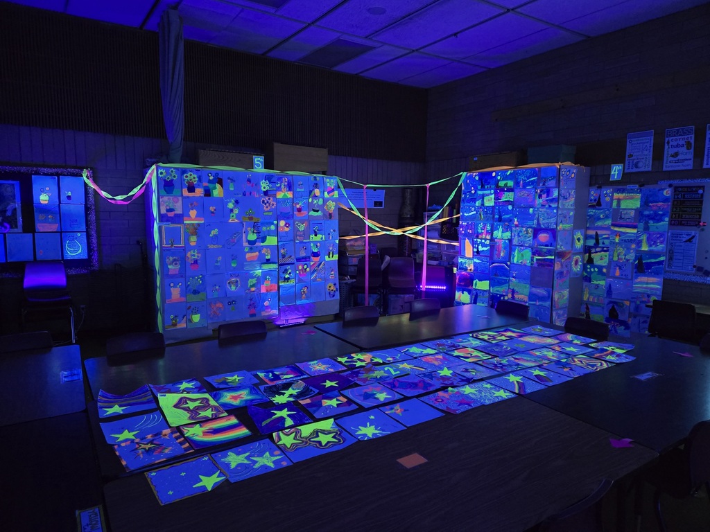 Students and families were able to explore glowing Vincent Van Gogh-inspired artwork during Evergreen STEM Elementary School’s art show and STEM Night. Displays feature colorful “Starry Night” and sunflower-themed student art illuminated under black lights.