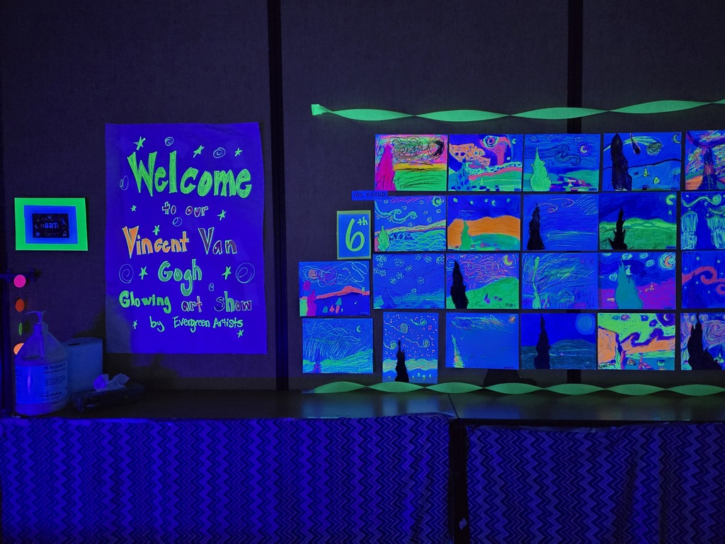 Students and families were able to explore glowing Vincent Van Gogh-inspired artwork during Evergreen STEM Elementary School’s art show and STEM Night. Displays feature colorful “Starry Night” and sunflower-themed student art illuminated under black lights.