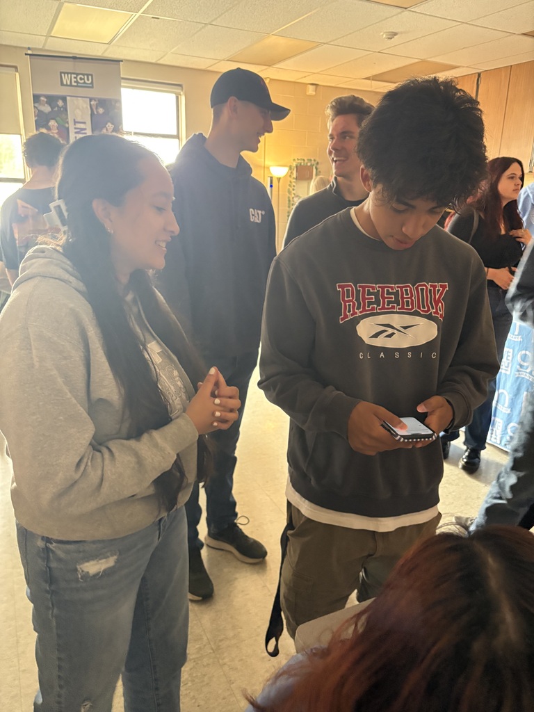 Sedro-Woolley High School students participate in the “Bite of Reality” financial simulation while speaking with WECU volunteers at different budgeting stations. Students review financial information, ask questions and make decisions about real-world expenses such as housing, transportation, groceries and childcare during the hands-on financial literacy activity.