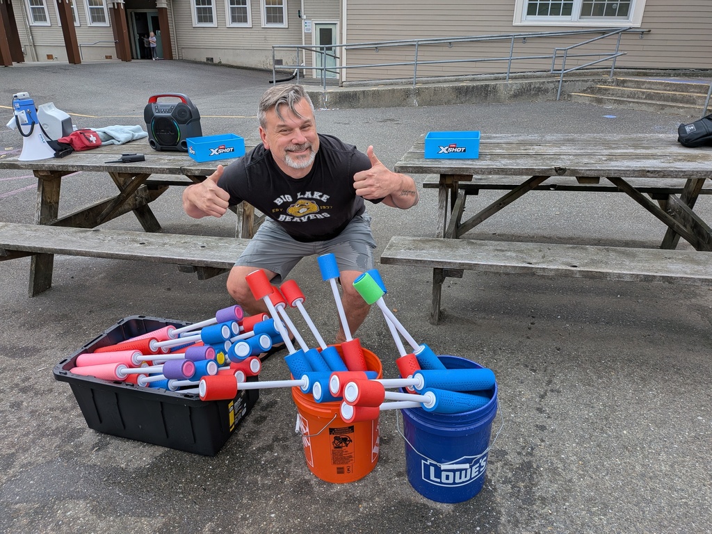Big Lake Elementary students use water shooters to soak Principal Matt Lutes during the school’s first Surprise Attendance Day celebration.