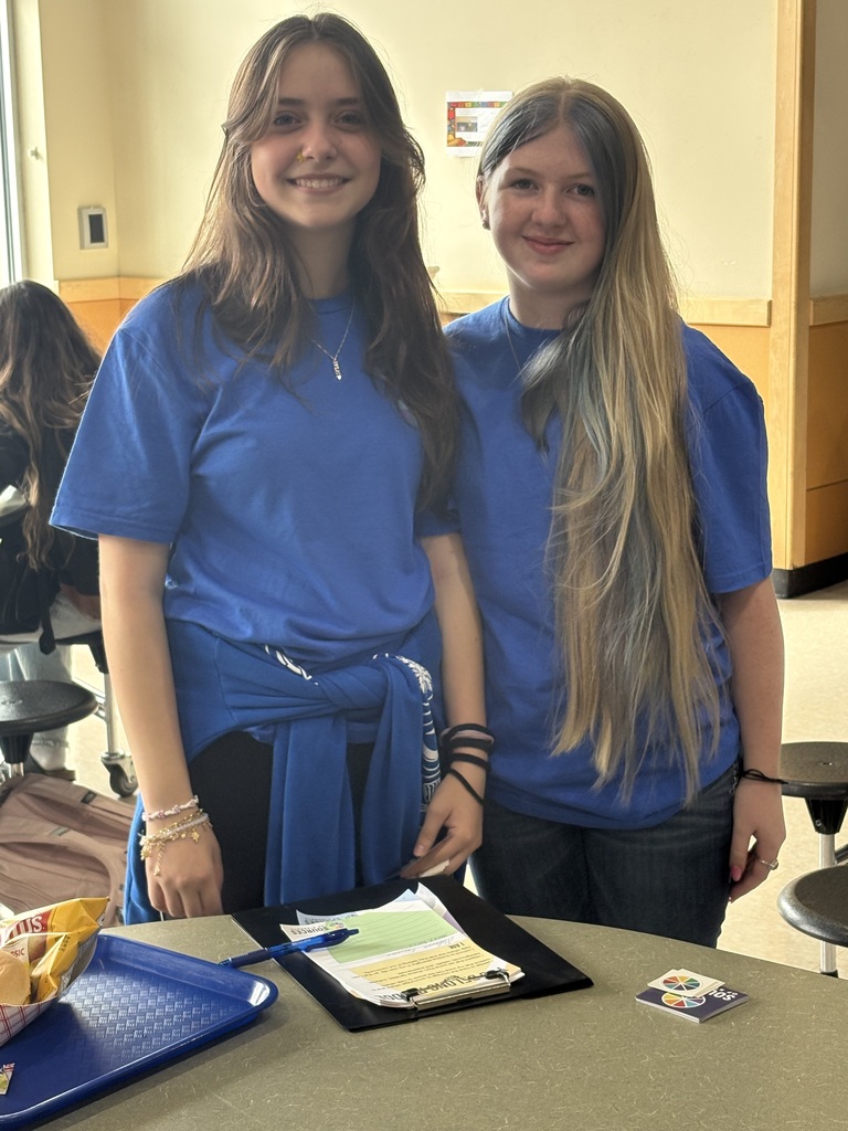 Cascade Middle School students participate in a Sources of Strength “You Belong” campaign during lunch. Students hold signed pledge sheets promoting encouragement, respect for different backgrounds and experiences, and a commitment to helping others feel that they belong in their school community.