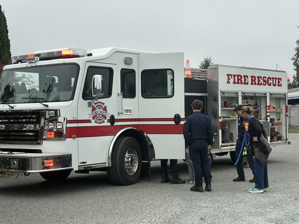 Photos show Good Beginnings Preschool students visiting with Sedro-Woolley firefighters and EMTs during Fire Prevention Week. Students explore a fire truck and ambulance, see emergency equipment up close and learn about fire safety and the work of local first responders.