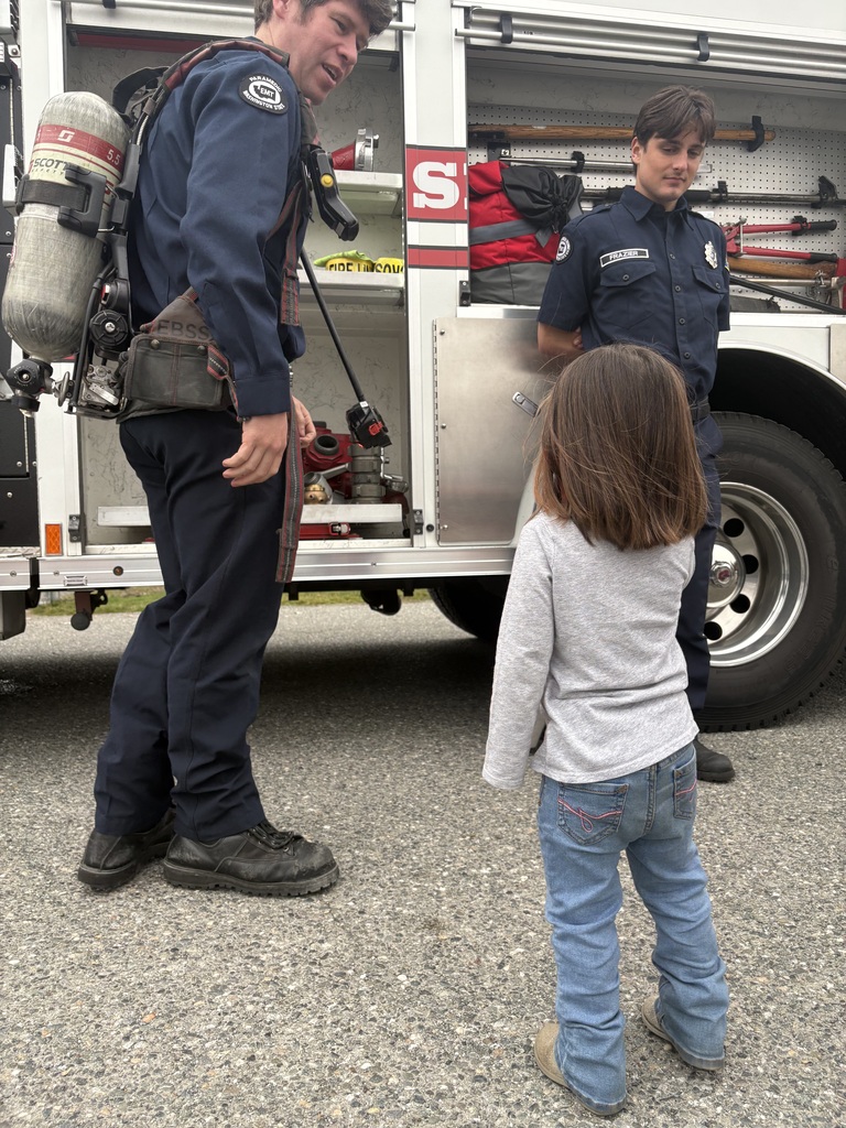 Photos show Good Beginnings Preschool students visiting with Sedro-Woolley firefighters and EMTs during Fire Prevention Week. Students explore a fire truck and ambulance, see emergency equipment up close and learn about fire safety and the work of local first responders.