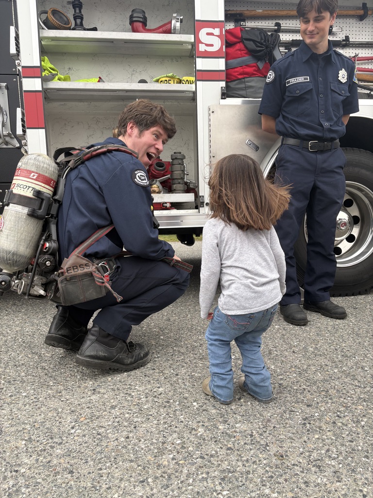 Photos show Good Beginnings Preschool students visiting with Sedro-Woolley firefighters and EMTs during Fire Prevention Week. Students explore a fire truck and ambulance, see emergency equipment up close and learn about fire safety and the work of local first responders.
