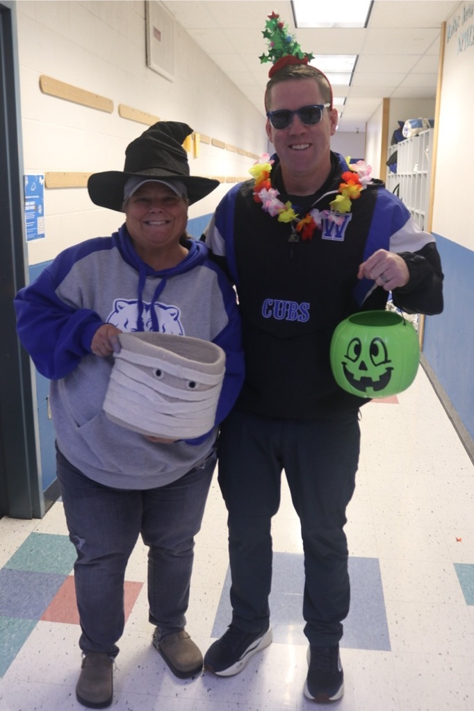 Preschool students from the Cubs Early Learning Academy, dressed in a variety of Halloween costumes, trick-or-treat through the hallways of Sedro-Woolley High School, visiting classrooms and collecting candy during a festive Halloween celebration.