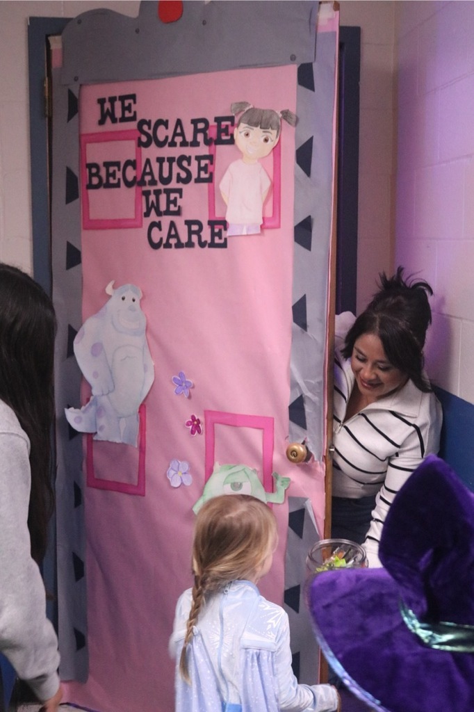 Preschool students from the Cubs Early Learning Academy, dressed in a variety of Halloween costumes, trick-or-treat through the hallways of Sedro-Woolley High School, visiting classrooms and collecting candy during a festive Halloween celebration.