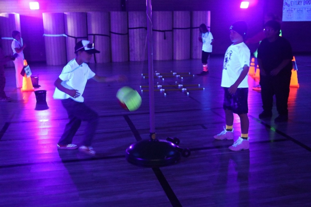 Terror Ball: Students play tetherball in Evergreen STEM Elementary's darkened gymnasium during the Halloween-themed Glow Day celebration.