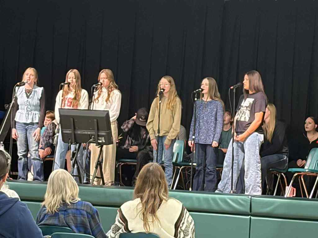 Girls singing on stage