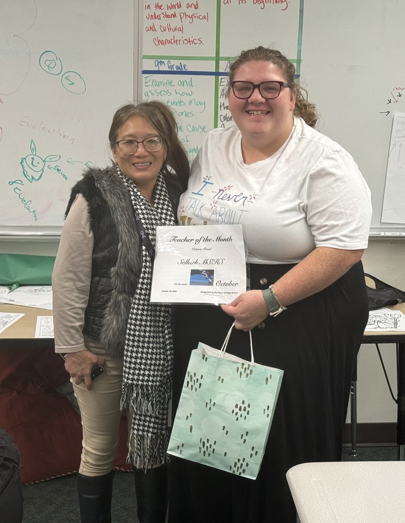 Teacher Victoria Poisel with House of Hope representative