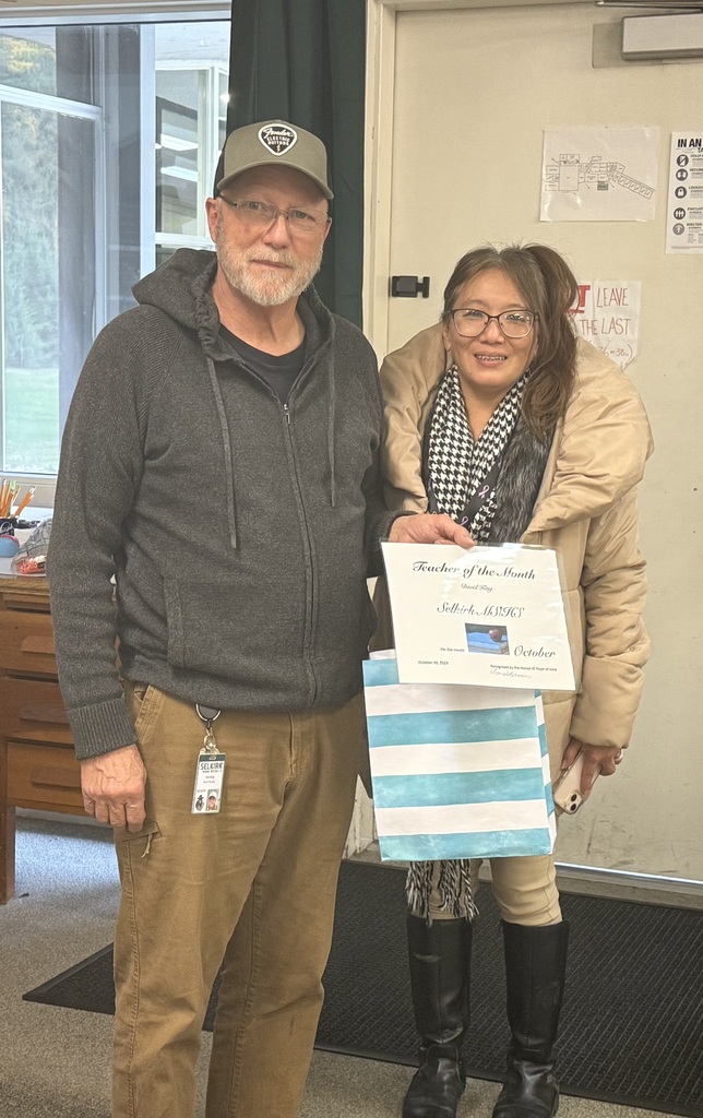 Teacher Dave King with House of Hope representative