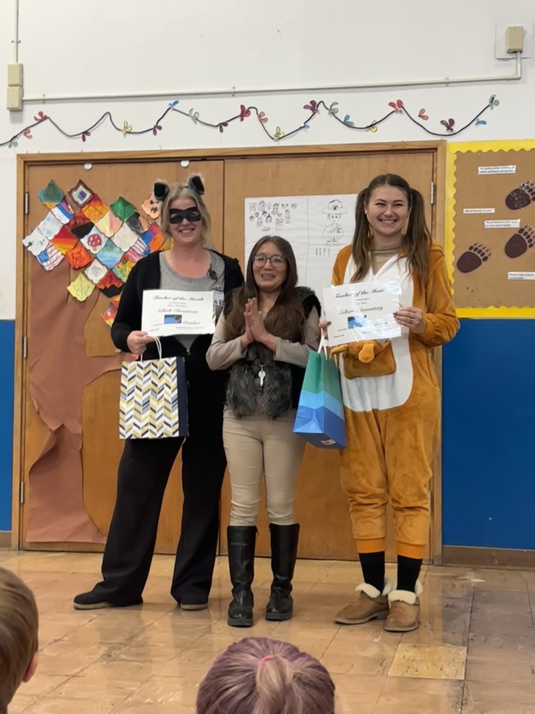 Teacher Sabrea Oberholtzer and School Psychologist Katie Hunt with House of Hope representative