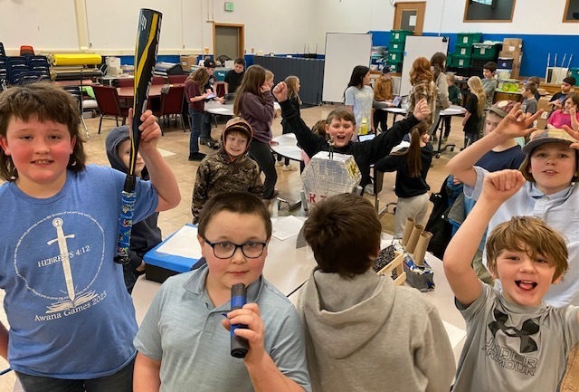 kids with inventions and cheering