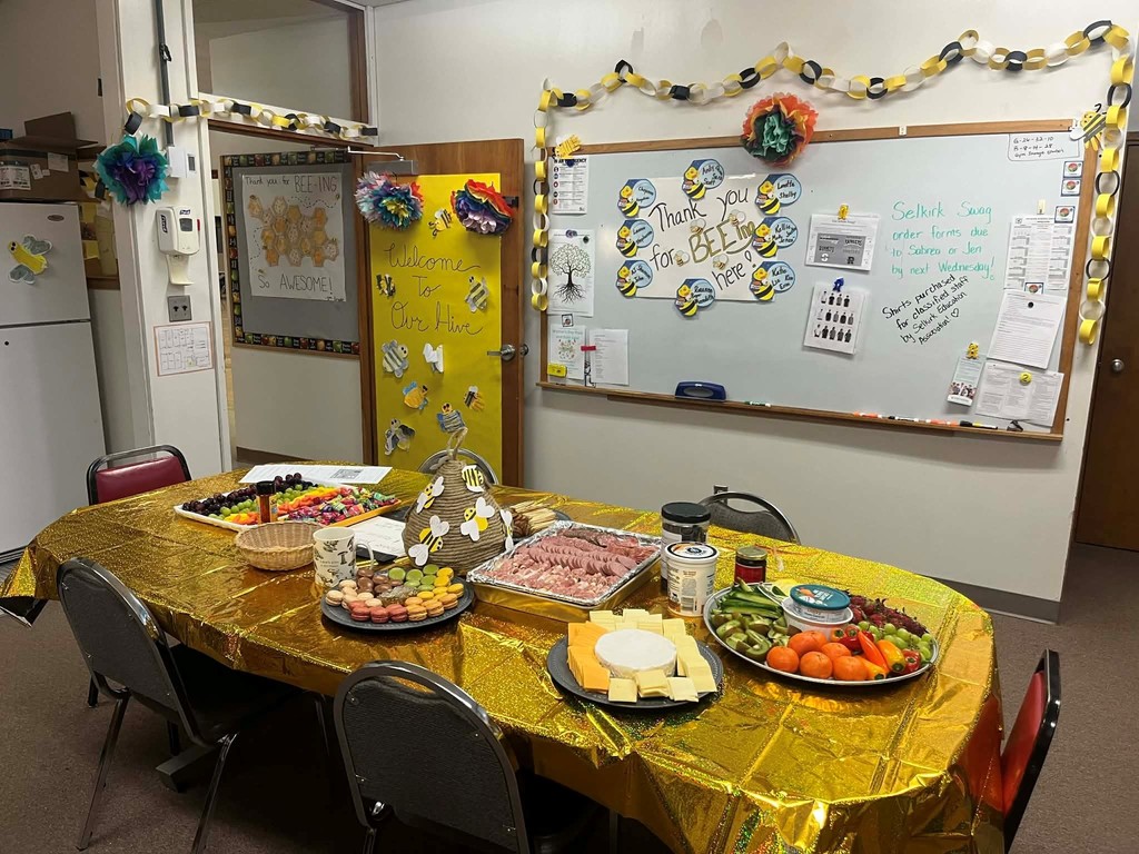 staff table with snack and decorated in a bee theme