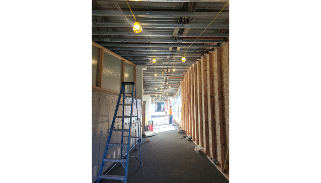 Abatement in the south hallway with strung lights.