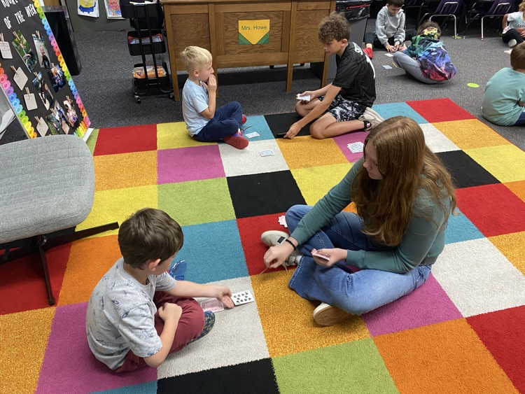 Eighth graders partnered with kindergarten today to learn a fun new card game that helps practice comparing bigger and smaller numbers.