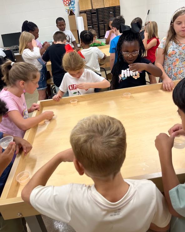 Miss Hannah’s math classes went to the library this week! We read The Lemonade Stand, then we had our very own lemonade tasting party. Students sampled both pink and yellow lemonade, then voted for their favorite. We graphed the results together and practiced collecting and interpreting data! 