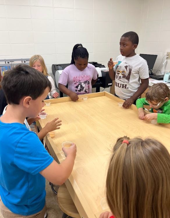 Miss Hannah’s math classes went to the library this week! We read The Lemonade Stand, then we had our very own lemonade tasting party. Students sampled both pink and yellow lemonade, then voted for their favorite. We graphed the results together and practiced collecting and interpreting data! 