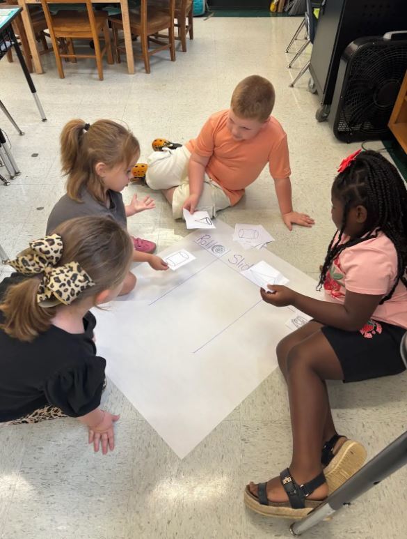 Mrs. Molly and Mrs. Katlyn's Kindergarten class had fun working in small groups to sort 3D shapes by attributes and real word objects.