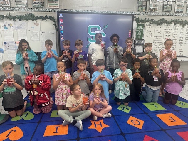 "  Mrs. Beth’s ELA classes celebrated completing their End-of-Year iReady Reading Diagnostic in style! 🎉 Students enjoyed a fun “Sip, Sip, Hooray!” iReady Treat Day featuring their very own custom-decorated cups, refreshing flavored water, and their favorite candies. 🍬🥤  We are so proud of all their hard work, growth, and perseverance this year. Way to go, readers! 💚📖  "