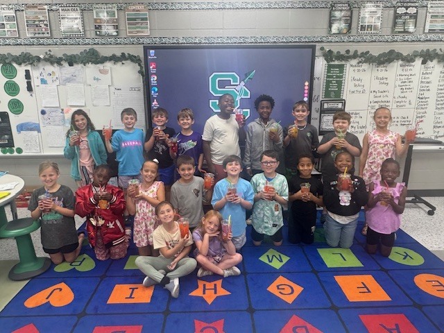 "  Mrs. Beth’s ELA classes celebrated completing their End-of-Year iReady Reading Diagnostic in style! 🎉 Students enjoyed a fun “Sip, Sip, Hooray!” iReady Treat Day featuring their very own custom-decorated cups, refreshing flavored water, and their favorite candies. 🍬🥤  We are so proud of all their hard work, growth, and perseverance this year. Way to go, readers! 💚📖  "