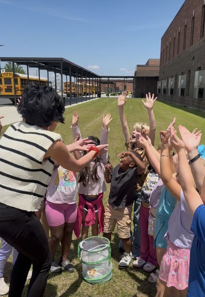Mrs. Jodi Harper's class watching the butterflies fly away.