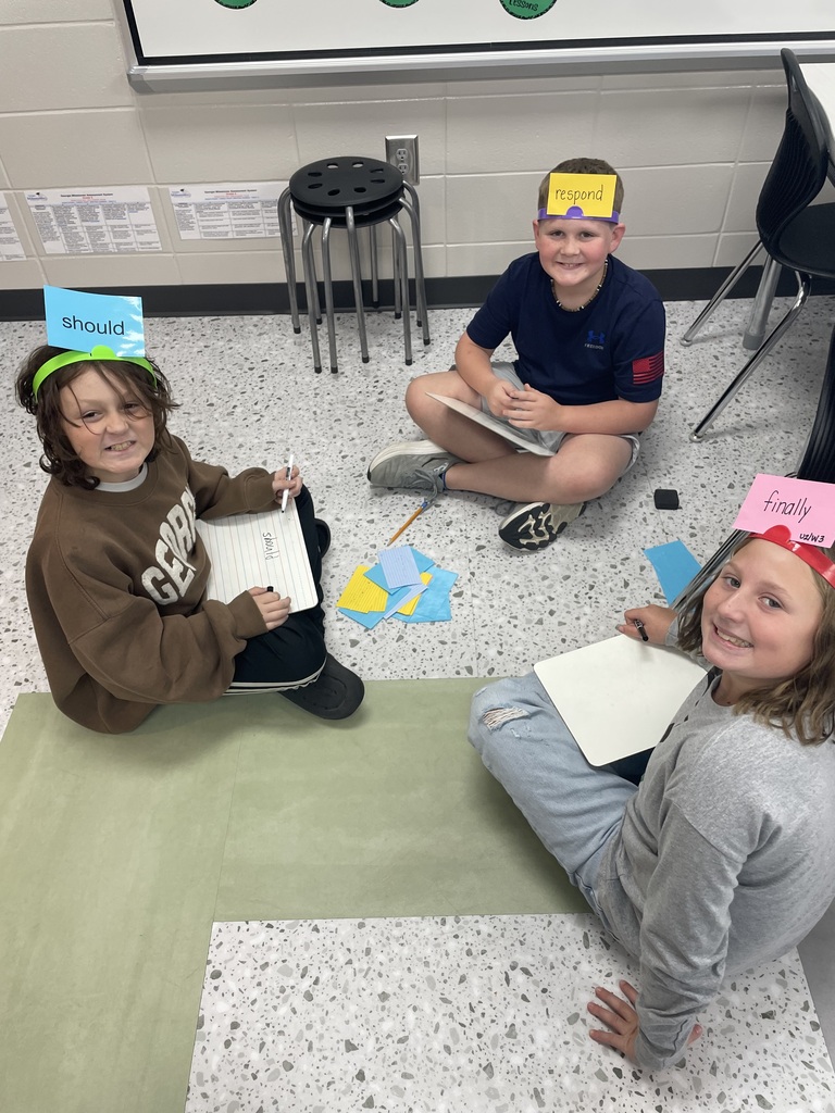 "📚✨ Learning + Fun = A Great Day! ✨📚 We had a great time reviewing our Unit 2 Reading Standards and Spelling today! Our students worked hard while having fun with hands-on activities. 📝📖 They especially enjoyed Headband Spelling, where they had to think, collaborate, and use their spelling skills. We also went on a scavenger hunt around the classroom to find and categorize different character traits. 🔎🧠 I love seeing my students engaged, moving, thinking, and learning together! 💚🖤🤍 Great job, 5th grade! Keep up the hard work! 👏📚"