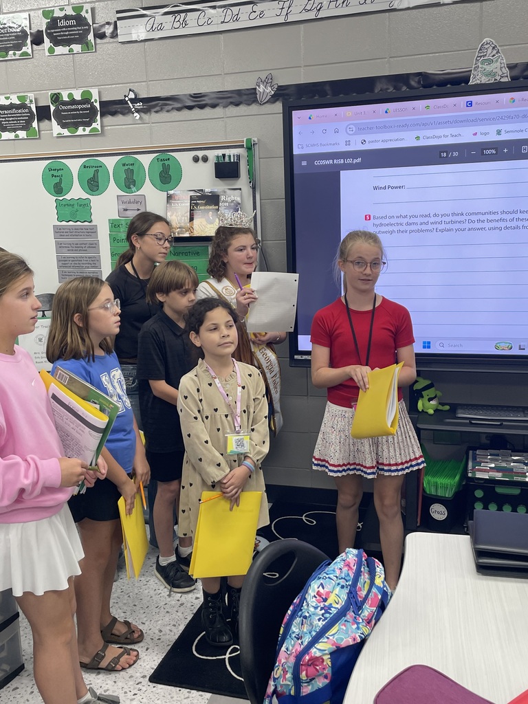 "⚡️ Expository Writing in Mrs. Croom’s ELA Class! 🌬️💨  After reading two informational texts as part of our expository writing unit, Mrs. Croom’s ELA students engaged in a lively debate about the use of hydroelectric plants and wind turbines as sources of energy.  Students responded to a writing prompt asking whether communities should continue to fund each of these energy sources. They had to take a position, defend their reasoning, and support their ideas with evidence from both texts.  Students also had to consider both sides of the issue by explaining whether the benefits outweigh the problems associated with each energy source.  We are working hard to become stronger writers by learning to use evidence, explain our thinking, and support our claims! 📝📚💚"