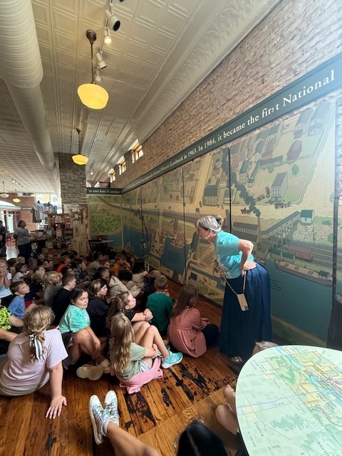 Lady speaking at museum