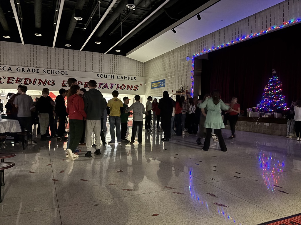 A group of students dance.  