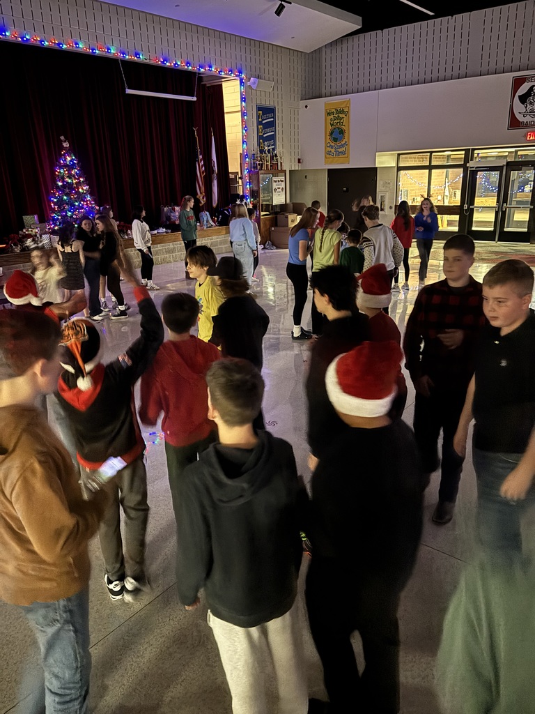 A group of students dance.  