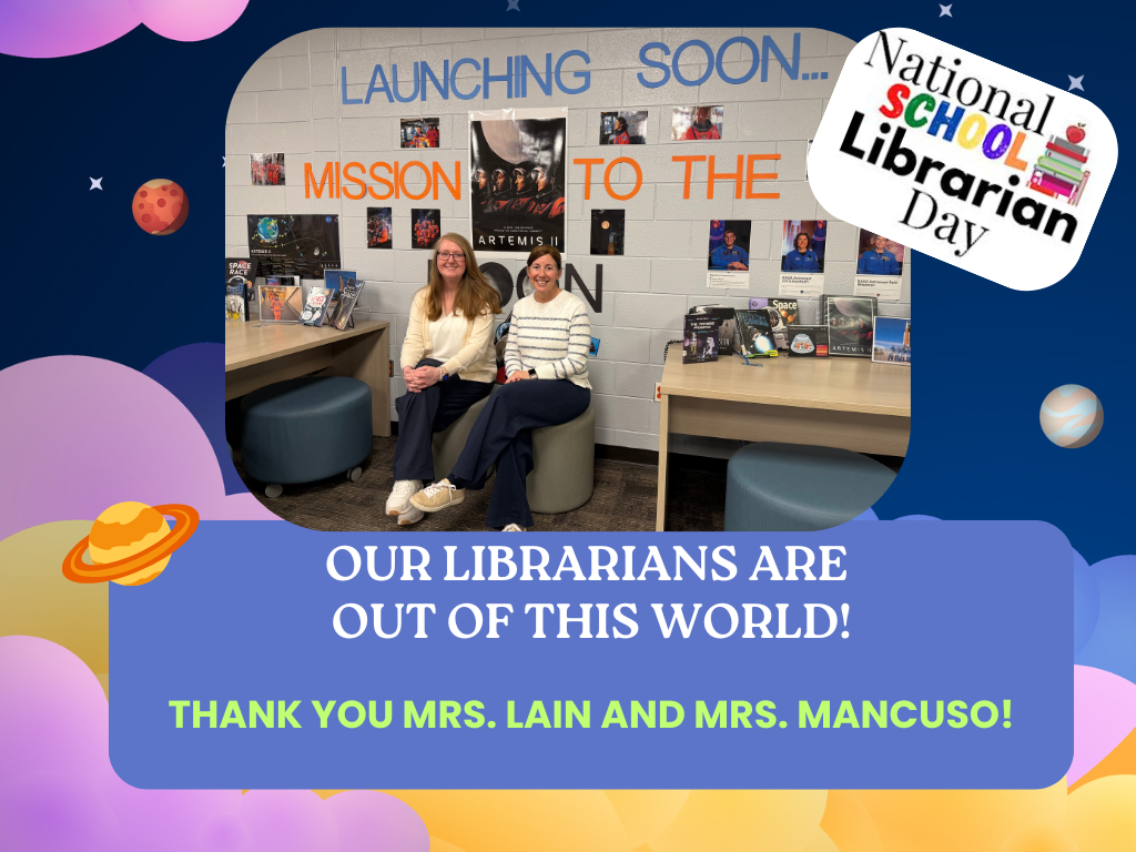 Two female librarians smilling