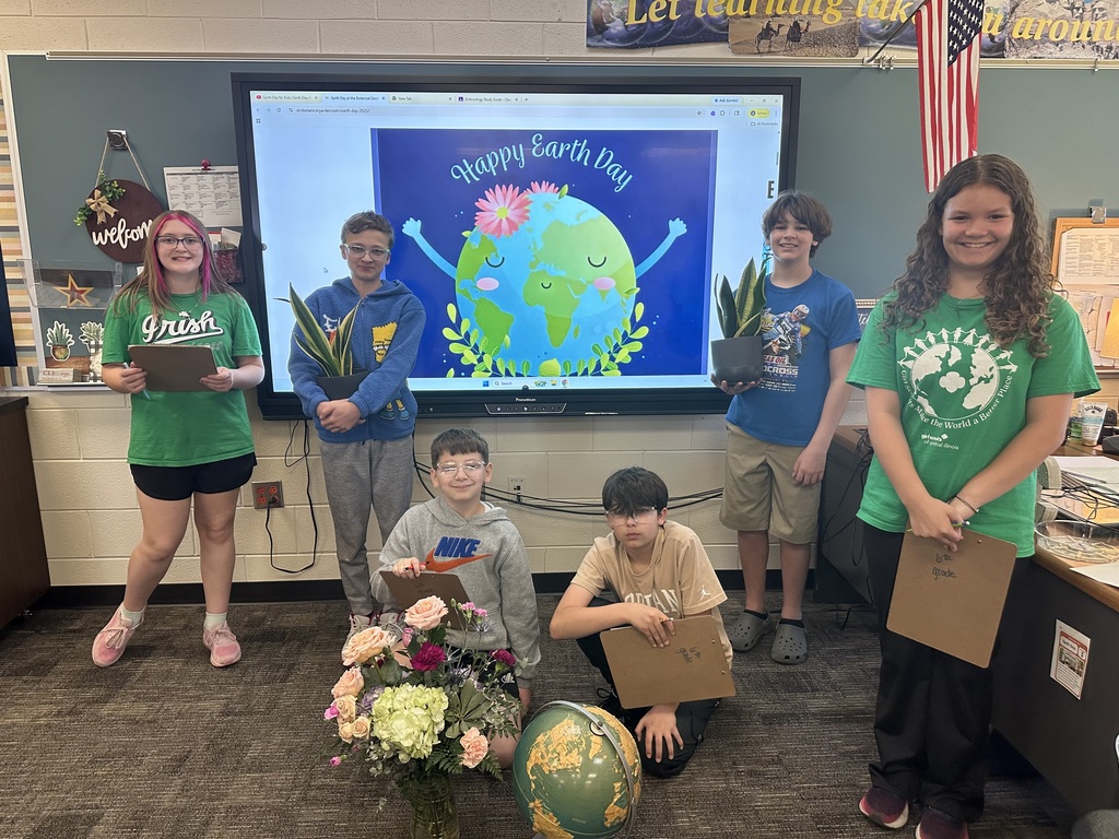 6th Grade Students with plants celebrating Earth Day @ SGS.