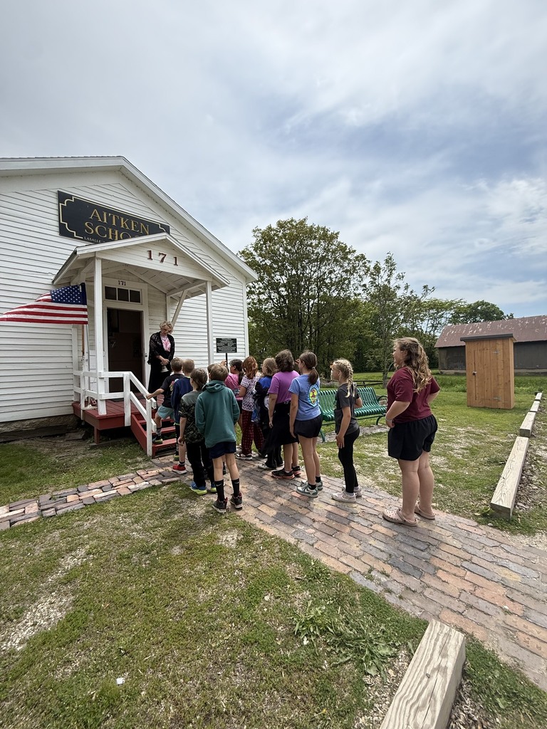 Students outside schoohouse