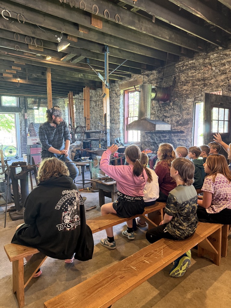 Students in the blacksmith shop