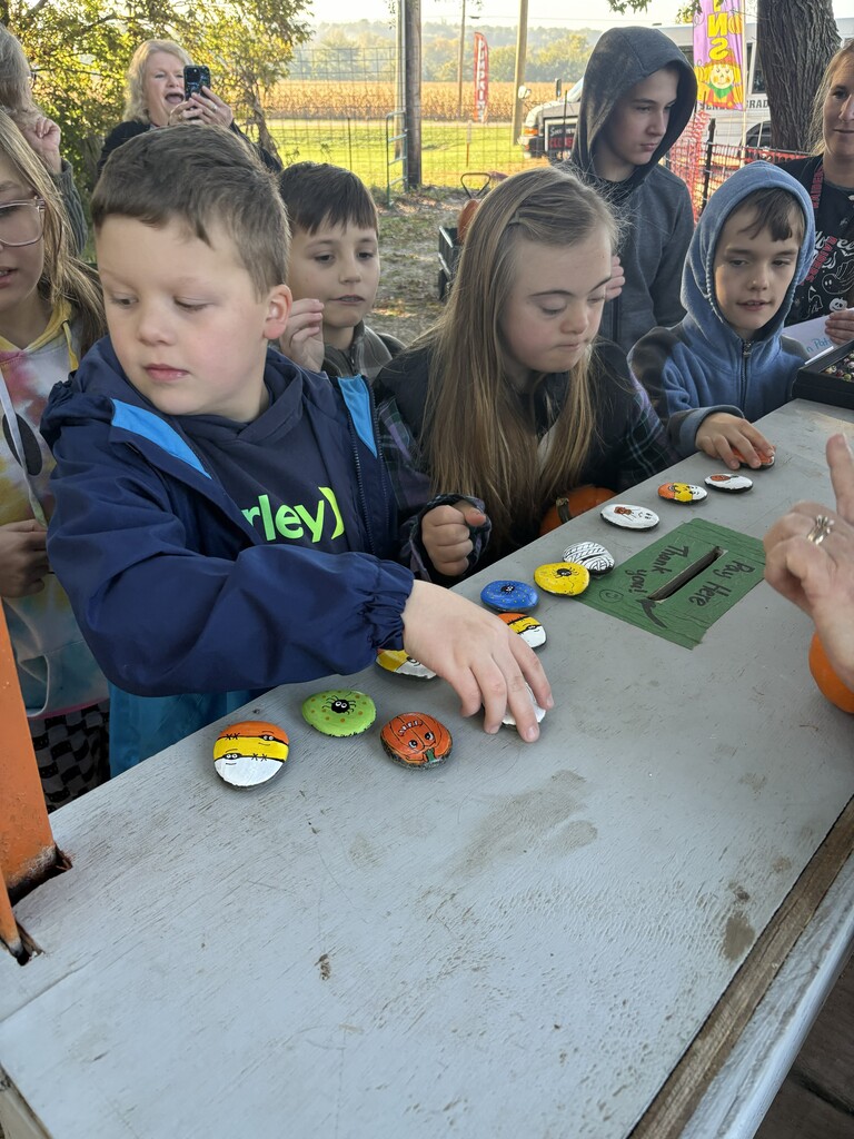 Picking out a decorated rock from Mrs. Beck.