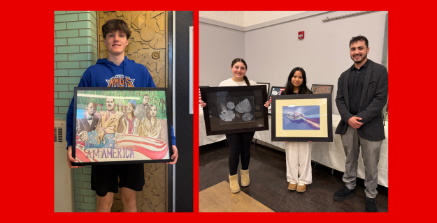Students holding their artwork.