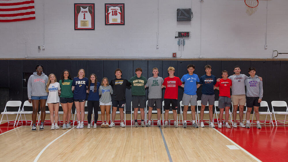 Student athlete group photo in gymnasium.