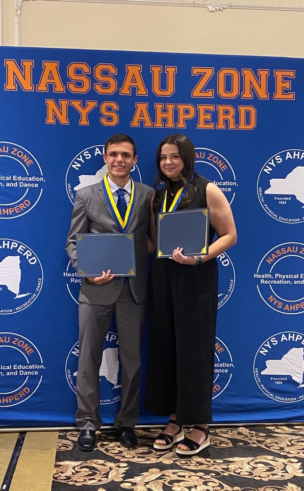 Two students receiving awards.