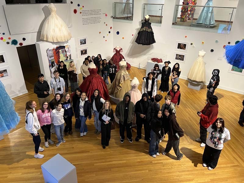 Students standing in art room.