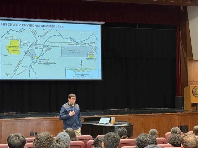 Man giving presentation to students.